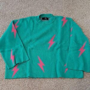 Dressed in LALA Teal Crewneck Sweater with Pink Lightning Bolts